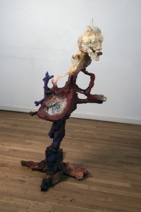 Is the Lipstick too Much, (view 1),  2023, prints on paper, wool, plastic, metal, wood, crushed glass, mirrors, and pigments 53 x 28 x 27 inches